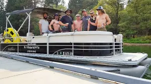 a group of people riding on the back of a truck