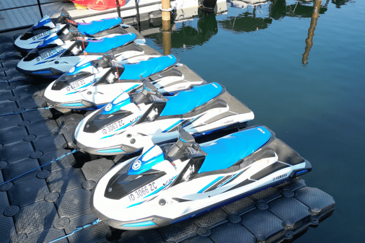 a row of parked motorcycles sitting on top of a boat