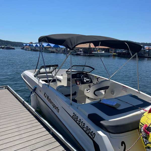 a boat is docked next to a body of water