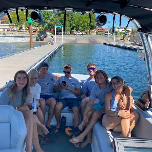 a group of people sitting on a boat