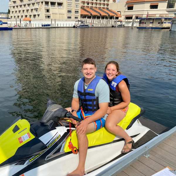a person sitting on a boat in the water