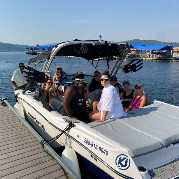 a group of people in a boat on a body of water